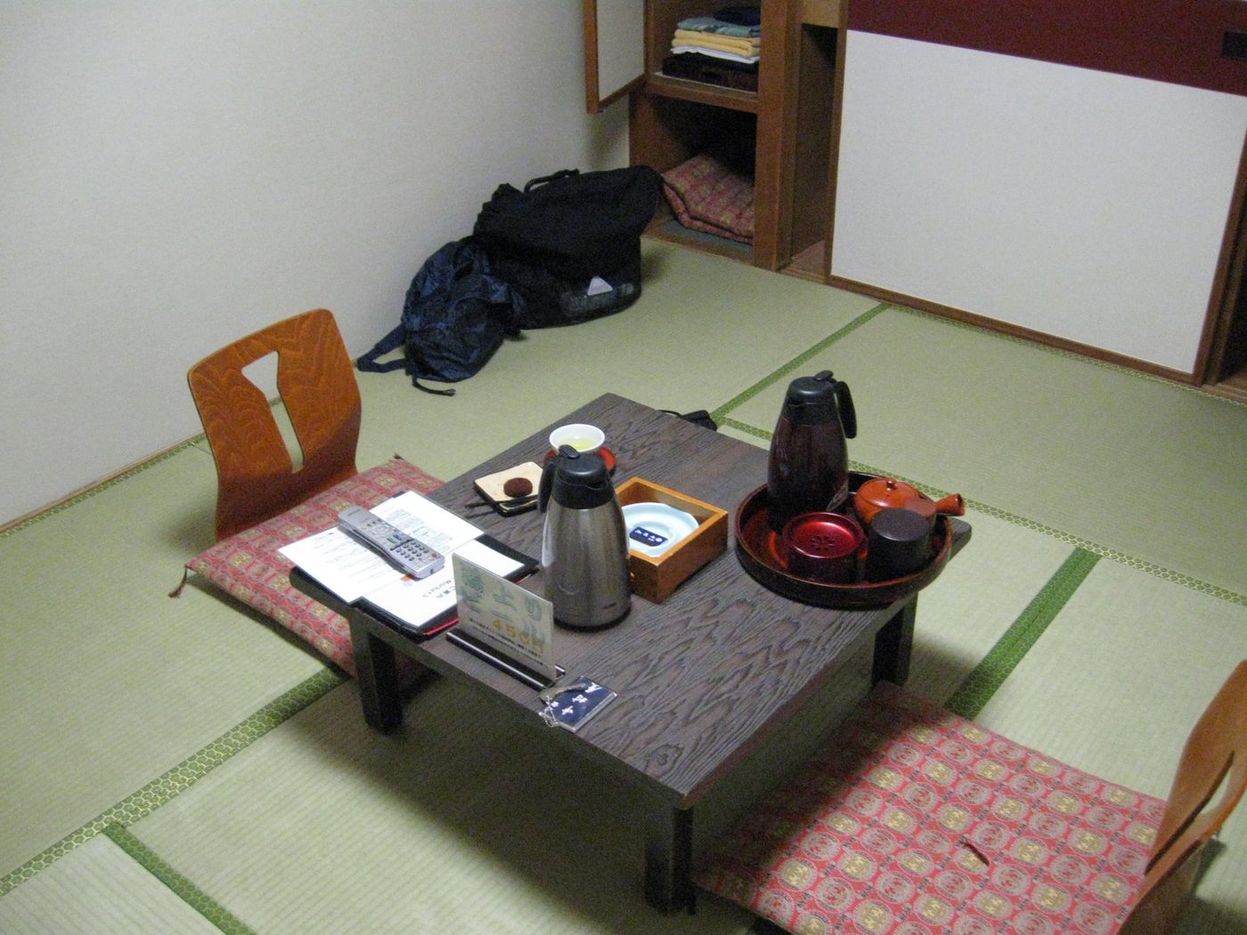 Tatami guest room with low table and garden view